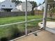 Screened in porch with an exterior view of a grassy and fenced backyard at 107 Brookhaven Rd, Summerville, SC 29486
