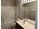 Full bathroom with a shower and tub, vanity sink, and a large mirror at 107 Brookhaven Rd, Summerville, SC 29486