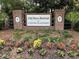 Elegant entrance sign at Old Rice Retreat, Cane Bay Plantation, framed by brick columns and landscaping at 107 Brookhaven Rd, Summerville, SC 29486