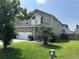 Two-story home featuring a well-manicured lawn, and a two-car garage at 107 Brookhaven Rd, Summerville, SC 29486