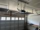 Spacious garage with shelving, work bench, and an automatic door at 107 Brookhaven Rd, Summerville, SC 29486