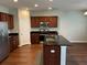 Updated kitchen featuring stainless steel appliances, island, and dark wood cabinetry at 107 Brookhaven Rd, Summerville, SC 29486