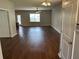 Spacious living room with modern ceiling fan and beautiful hardwood flooring throughout at 107 Brookhaven Rd, Summerville, SC 29486