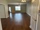Spacious living room with modern ceiling fan and beautiful hardwood flooring throughout at 107 Brookhaven Rd, Summerville, SC 29486
