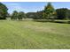 Beautiful pond and green space with mature trees offer a serene setting at 107 Brookhaven Rd, Summerville, SC 29486