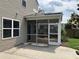 Covered screened-in porch with an exterior view of a patio and grassy and fenced yard at 107 Brookhaven Rd, Summerville, SC 29486