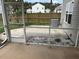 The screened-in porch has an exterior view of an air conditioning unit and a fenced yard at 107 Brookhaven Rd, Summerville, SC 29486