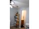 View of the bathroom with dark wood cabinets, sink, and toilet from the opening of a neutrally decorated room at 107 Twin Tree Dr, Summerville, SC 29485