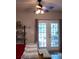 Bedroom with light wood floors, bench, shelving, a ceiling fan, and a glass door leading to the outside at 107 Twin Tree Dr, Summerville, SC 29485