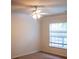 A simple bedroom with a ceiling fan and natural light through the window at 107 Twin Tree Dr, Summerville, SC 29485