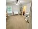 Spacious room with neutral walls and carpet, complemented by a ceiling fan and natural light from a window at 107 Twin Tree Dr, Summerville, SC 29485