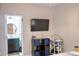 Bedroom with a television, shelving, wood floors, and doorway leading to the bathroom at 107 Twin Tree Dr, Summerville, SC 29485