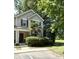 Charming townhome featuring a well-maintained lawn, purple shutters, and a welcoming front entrance at 107 Twin Tree Dr, Summerville, SC 29485