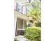 Inviting home exterior with a cozy front porch, brick accents, and manicured greenery at 107 Twin Tree Dr, Summerville, SC 29485
