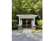 Community mail kiosk featuring white pillars with brick bases and a charming white roof at 107 Twin Tree Dr, Summerville, SC 29485