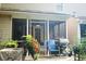 Cozy screened porch with seating, a grill, and potted plants offers a relaxing outdoor space at 107 Twin Tree Dr, Summerville, SC 29485