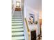A naturally lit staircase ascends next to an ornamental fireplace at 107 Twin Tree Dr, Summerville, SC 29485