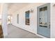 Inviting front porch with white columns, a blue front door, and shiplap siding at 109 Battle Boat Blvd, Summerville, SC 29485