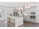 Modern kitchen with stainless steel appliances, gray cabinets, a central island with seating at 109 Battle Boat Blvd, Summerville, SC 29485