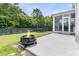 This is a backyard with a fire pit, a patio, a screened in porch, and a trampoline at 110 Bloomfield St, Summerville, SC 29486
