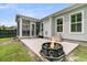 This backyard features a fire pit, a patio, a screened in porch, and a grill at 110 Bloomfield St, Summerville, SC 29486