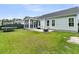 This backyard features a fire pit, a trampoline, a patio, and a screened in porch at 110 Bloomfield St, Summerville, SC 29486