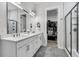 Elegant bathroom with double sinks, granite countertops, and a glass-enclosed shower at 110 Bloomfield St, Summerville, SC 29486
