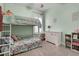 This bedroom features a bunk bed, a white dresser, and is painted with light green walls at 110 Bloomfield St, Summerville, SC 29486