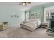 Serene bedroom with neutral tones, shuttered windows, and a cozy seating area, offering a peaceful retreat at 110 Bloomfield St, Summerville, SC 29486