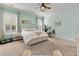 Inviting bedroom with a ceiling fan, plantation shutters, and soothing color scheme at 110 Bloomfield St, Summerville, SC 29486