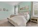 Bright bedroom with a comfortable bed, complemented by stylish decor and ample natural light from the window at 110 Bloomfield St, Summerville, SC 29486