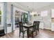 Dining area with sliding doors leading to an outdoor screened-in porch, perfect for enjoying meals at 110 Bloomfield St, Summerville, SC 29486
