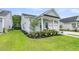 Well-maintained home with a manicured lawn, beautiful flower beds, and a two-car garage at 110 Bloomfield St, Summerville, SC 29486