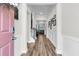 Inviting foyer with wood flooring, white wainscoting, and a view of the staircase and office space at 110 Bloomfield St, Summerville, SC 29486