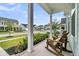 Inviting front porch with rocking chairs overlooking the landscaped front yard and neighborhood street at 110 Bloomfield St, Summerville, SC 29486