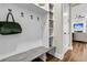 Functional mudroom with built-in shelving, hooks, and a bench, conveniently located near the entrance and living area at 110 Bloomfield St, Summerville, SC 29486