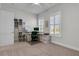 Sunlit office featuring built-in shelving and two windows with plantation shutters at 110 Bloomfield St, Summerville, SC 29486