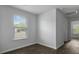 Sunlit bedroom with a large window and dark wood-look flooring at 125 Mims Academy Dr, Harleyville, SC 29448