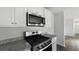 Modern kitchen featuring stainless steel gas range and microwave above the range at 125 Mims Academy Dr, Harleyville, SC 29448