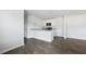 Open living area with wood floors and a granite countertop at 125 Mims Academy Dr, Harleyville, SC 29448