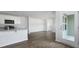 Bright, open-concept living space featuring wood floors and a patio door at 125 Mims Academy Dr, Harleyville, SC 29448