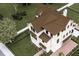 Aerial view of a sprawling estate, featuring a pool, brick paved driveway and lush greenery around the property at 13 Trumbo St, Charleston, SC 29401