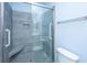 Modern tiled shower with glass door, bench, and grab bars at 1319 Basildon Rd, Mount Pleasant, SC 29466