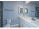 Bright bathroom features a vanity with white countertop, a large mirror and tiled shower at 1319 Basildon Rd, Mount Pleasant, SC 29466