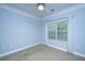 Bedroom with neutral carpet, window with blinds, ceiling fan, and blue walls at 1319 Basildon Rd, Mount Pleasant, SC 29466