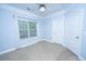 A bedroom featuring a fan, window, beige carpet, and two closets at 1319 Basildon Rd, Mount Pleasant, SC 29466