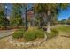 Community sign in The Battery Park West is surrounded by manicured landscaping with a lush green lawn at 1319 Basildon Rd, Mount Pleasant, SC 29466