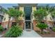 Building entrance features a red brick facade and stairs that lead to an upper level at 1319 Basildon Rd, Mount Pleasant, SC 29466