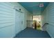 Hallway view with an exterior door and view outside of palm trees from the upper level at 1319 Basildon Rd, Mount Pleasant, SC 29466