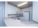 Kitchen featuring white cabinets, stainless steel appliances, and neutral countertops with a breakfast bar at 1319 Basildon Rd, Mount Pleasant, SC 29466